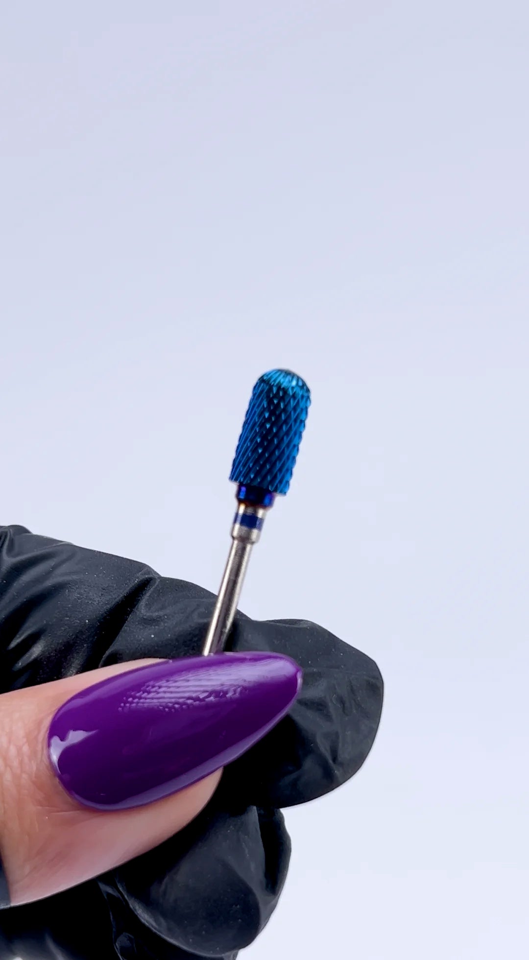 <img src="website-video-blue-carbide-e-file-bit-332-barrel-ball-top-compressed.mp4" alt="technician using nail carbide drill bit during manicure">