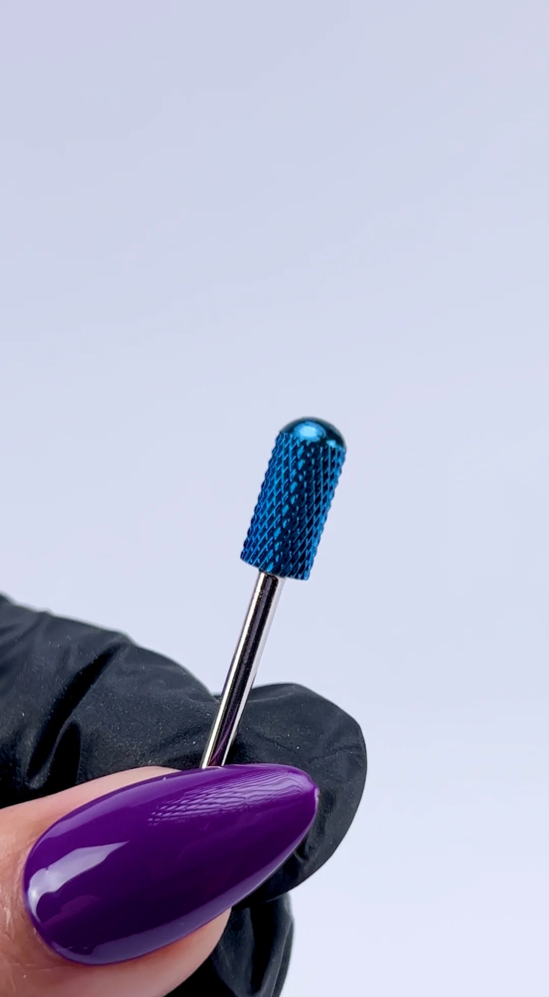 <img src="website-video-blue-carbide-e-file-bit-332-barrel-smooth-top-compressed.mp4" alt="technician using nail carbide drill bit during manicure">