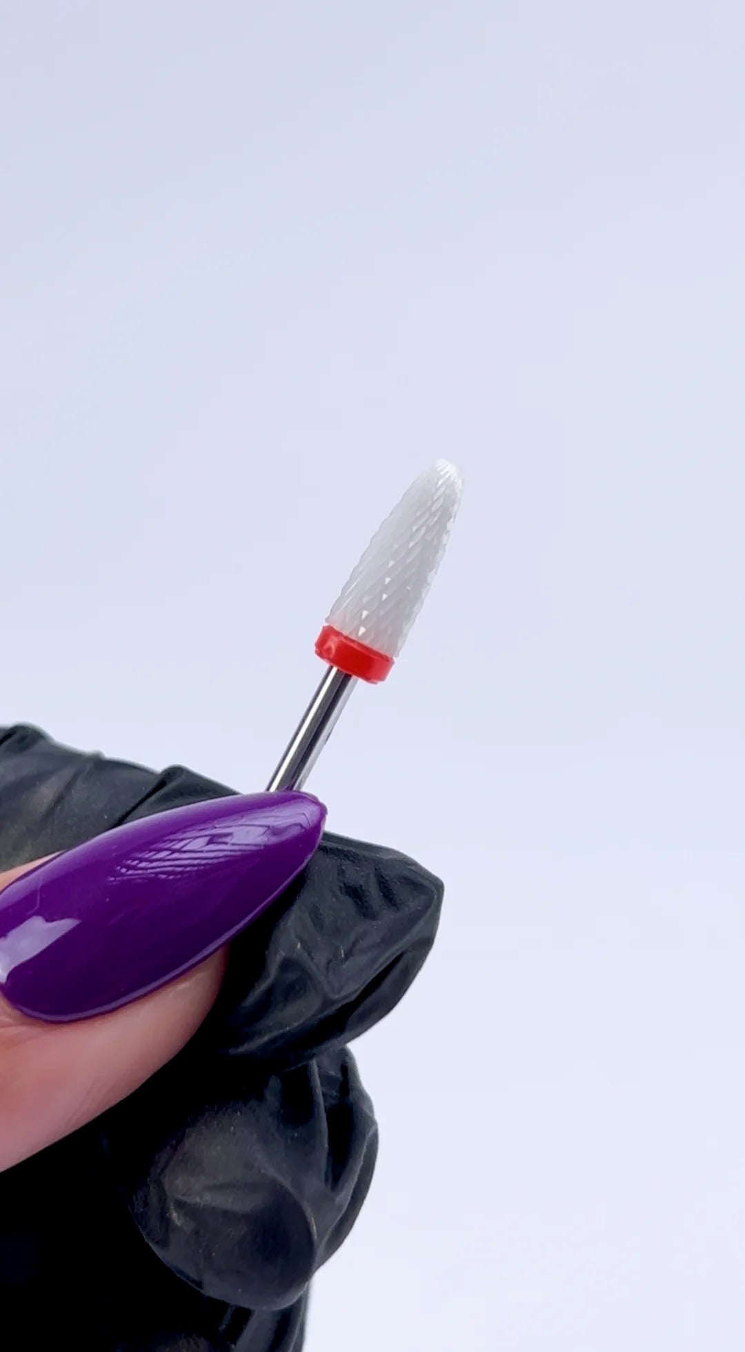 <img src="website-video-ceramic-e-file-bit-332-flame-compressed.mp4" alt="technician using nail carbide drill bit during manicure">